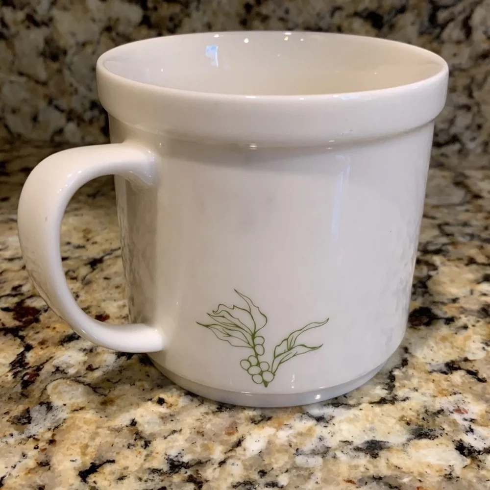 We Proudly Brew Starbucks coffee mug 12 ounces White and green